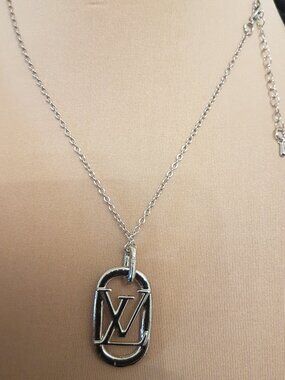 Silver tone charm necklace with  iconic initial